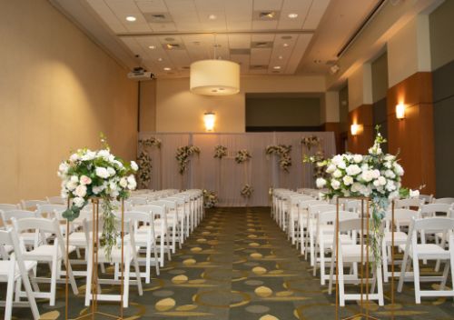 Wedding ceremony setup with aisle and floral decorations